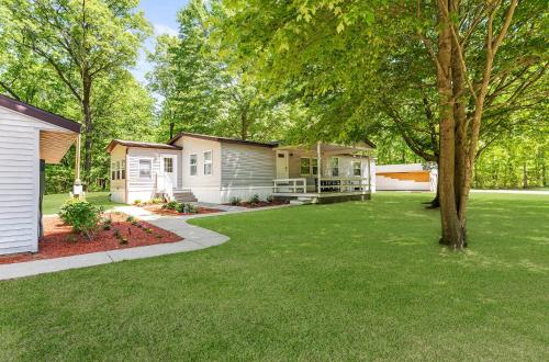 a row of houses in a yard with a tree at Home Field Hideaway in Pullman