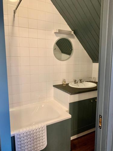 a bathroom with a tub and a sink at The Teesdale Hotel in Middleton in Teesdale
