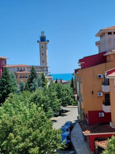 a view of a city with a tower in the distance at Relaks w Marina Cape 88 in Aheloy