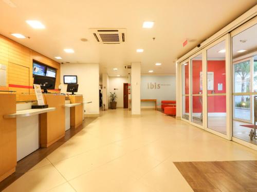 an empty lobby of an office building with a waiting room at ibis Montes Claros Shopping in Montes Claros
