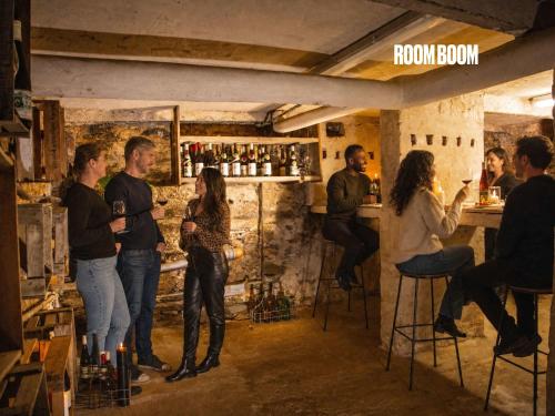 a group of people standing in a wine bar at Weingut Muehlenschenke - Game-Room, Vineyard, Sauna and more in Sankt Goarshausen