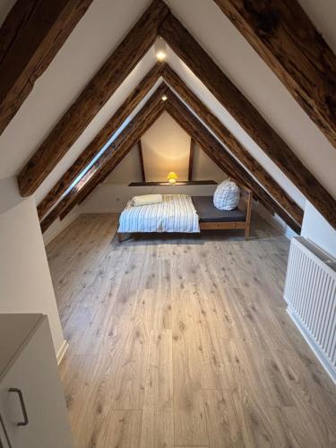 a attic bedroom with a bed in the attic at Zimmer in Wattenbek in Wattenbek