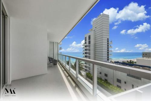 a balcony with a view of the ocean at Fontainebleau 2Dbl Queen Bed City plus Ocean View in Miami Beach