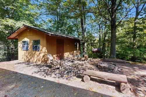 a small cabin in the middle of a forest at Hollow's End in Whittier