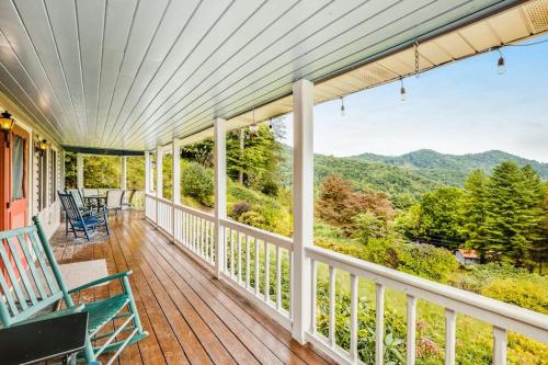a porch with rocking chairs and a view of the mountains at Angel View in Cullowhee