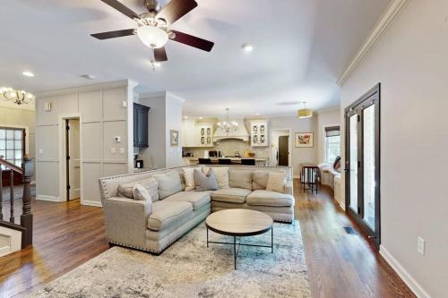 a living room with a couch and a table at The Marlin in Arden