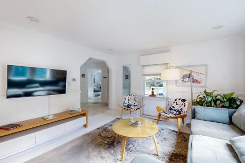 a living room with a couch and a table at The Lime House in Brevard