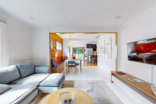 a living room with a couch and a table at The Lime House in Brevard