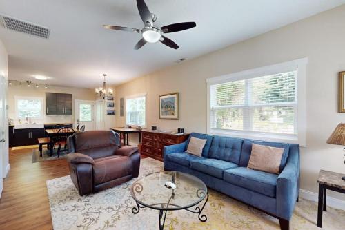 a living room with a blue couch and chairs at Cool Springs Manor in Asheville