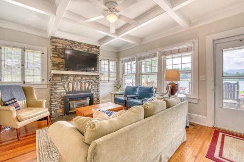 a living room with a couch and a fireplace at Chapel Side in Lake Junaluska