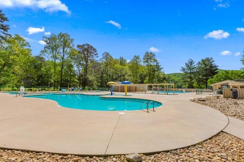 a swimming pool with a playground at Wunderland Cabin in Lake Lure