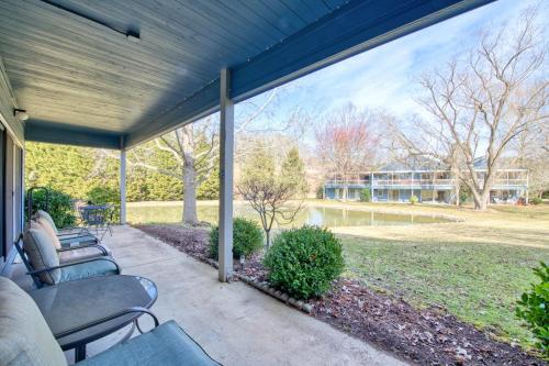 a porch with couches and a view of a park at Beehive Condo in Lake Junaluska