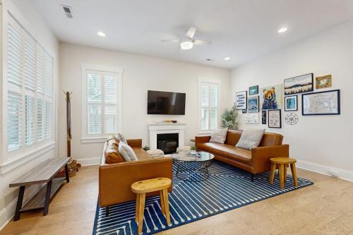a living room with a couch and a fireplace at Downtown Delight in Brevard