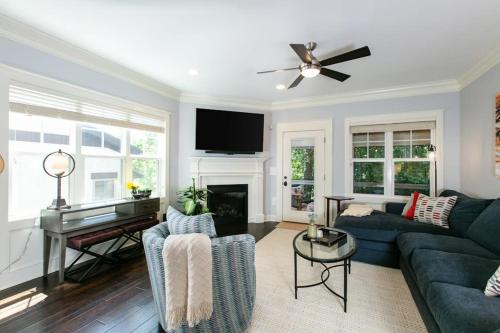 a living room with a couch and a piano at Blue Ridge Haven in Black Mountain