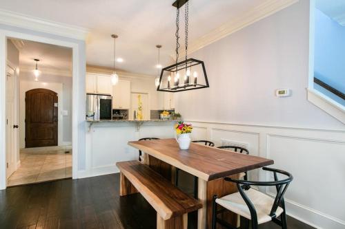 a dining room with a wooden table and chairs at Blue Ridge Haven in Black Mountain