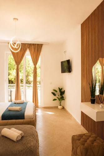 a bedroom with two beds and a window at Apartments Katana in Ulcinj