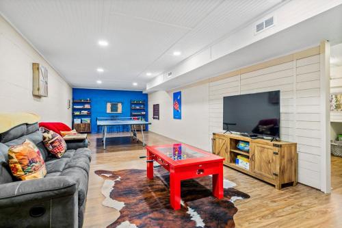 a living room with a couch and a red coffee table at Cherry Tree Lodge in Black Mountain