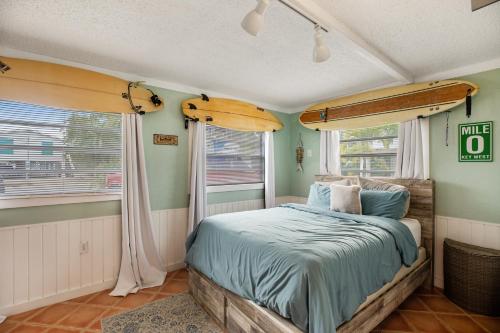 a bedroom with a bed and a window at LT04FLR Torchbearer - Lower in Little Torch Key