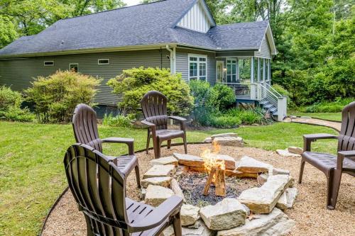 a fire pit in a yard with chairs around it at Hilltop Hideaway in Asheville