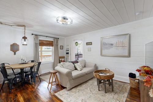 a living room with a couch and a table at Meet Me At The Creek in Whittier