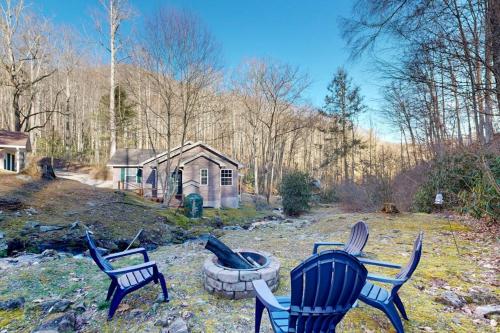 a group of chairs sitting in a yard at Mountain Hideaway in Sylva