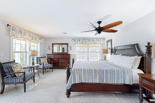 a bedroom with a bed and a ceiling fan at MA05 Bayfront Sunset Oasis in Marathon