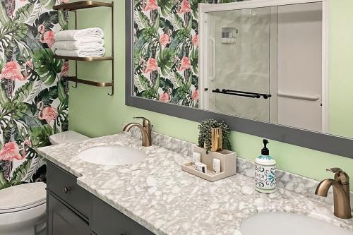 a bathroom with two sinks and a mirror at MA05 Bayfront Sunset Oasis in Marathon
