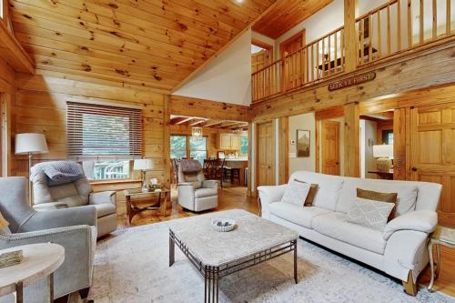 a living room with a white couch and a table at Bird's Nest in Saluda