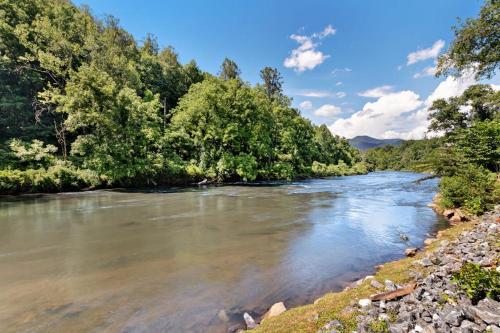 a river with trees on the side of it at 2 Bed 1 Bath Vacation home in Sylva in Sylva