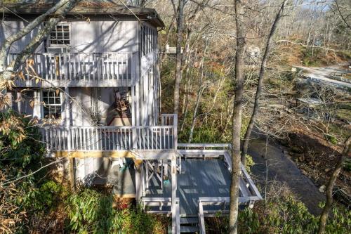 a house with a staircase leading up to it at Creekside Lodge in Franklin