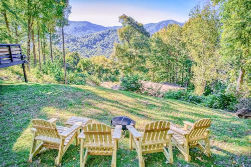a group of chairs and a table with a fire pit at Chipmunk Lane in Maggie Valley