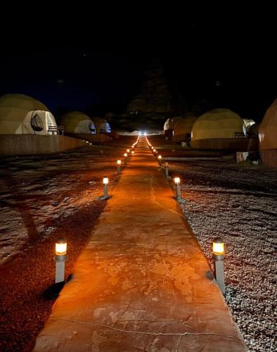 a row of lights on a road at night at elan luxury camp in Disah