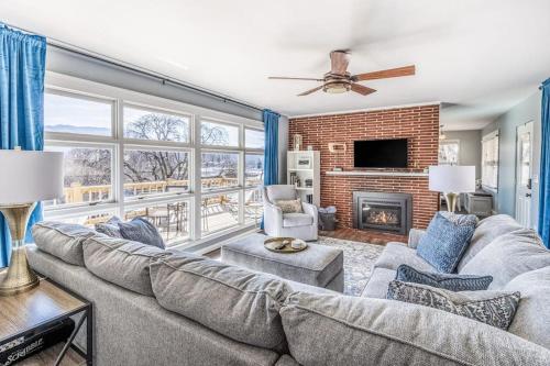 a living room with a couch and a fireplace at The Willows in Waynesville