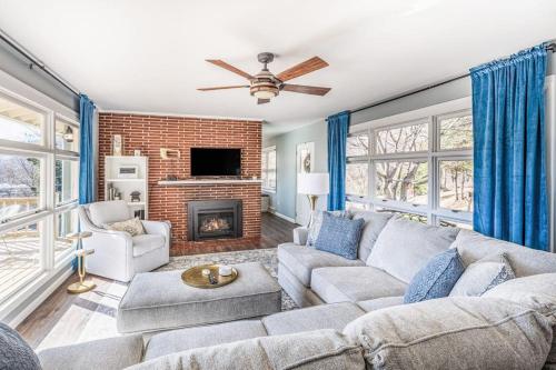 a living room with a couch and a fireplace at The Willows in Waynesville