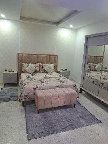 a bedroom with a bed and a large mirror at villa mellita in Mellita