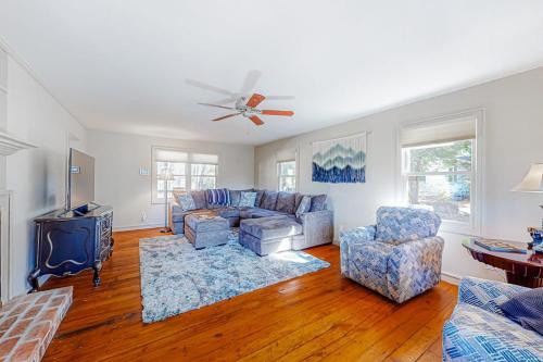 a living room with a couch and two chairs at Brevard Bungalow in Brevard