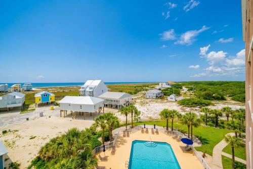 an aerial view of a resort with a swimming pool and the beach at The Dunes 503 in Gulf Shores