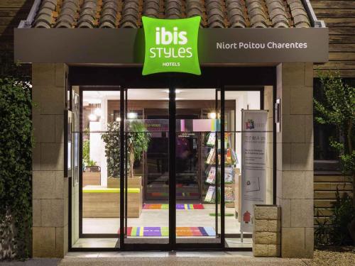 a store with a sign on the front of it at ibis Styles Niort Poitou Charentes in Vouillé