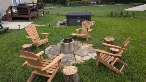 a group of chairs and a fire pit in a yard at Blueridge Brew View in Fairview