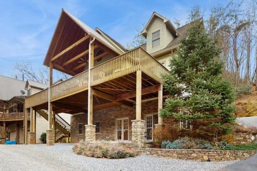 a large house with a wooden roof at Tuckaway Retreat in Sylva