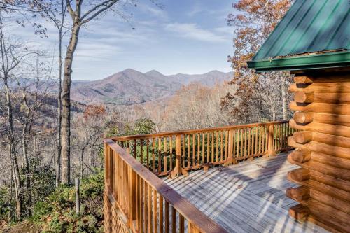 a wooden deck with a view of the mountains at Cloud Walk in Sylva