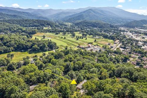 an aerial view of a town with trees and mountains at Cozy Mountain Hideaway in Waynesville
