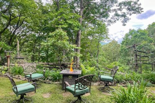 a group of chairs and a table in a yard at Simple blessings in Bryson City
