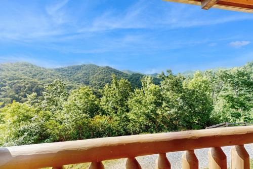 a view from the deck of a cabin with mountains at Slice of the Mountain in Franklin