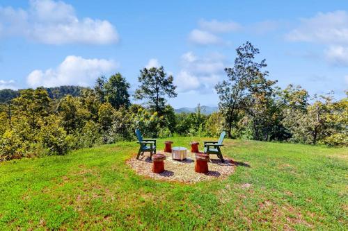 two picnic tables and two benches in a field at Nanuk in Franklin