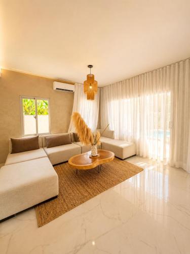 a living room with a couch and a table at Villa costa mar in Cabrera