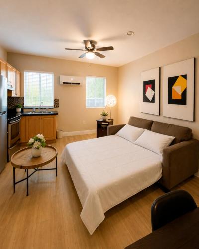 a bedroom with a bed and a table and a kitchen at Downtown Miami full apartment with kitchen in Miami