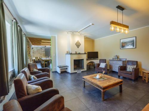 a living room with couches and a coffee table at Group Getaway in Amel in Amblève