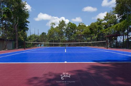 a tennis court with a net on top of it at Samloem Laguna Resort in Koh Rong Sanloem