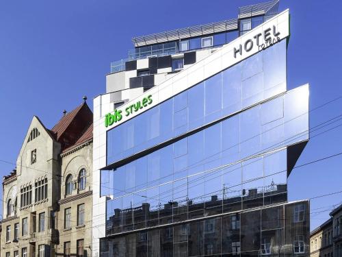 a building with a sign on the side of it at Ibis Styles Lviv Center in Lviv